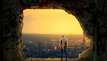 guitarist, cityscape, evening
